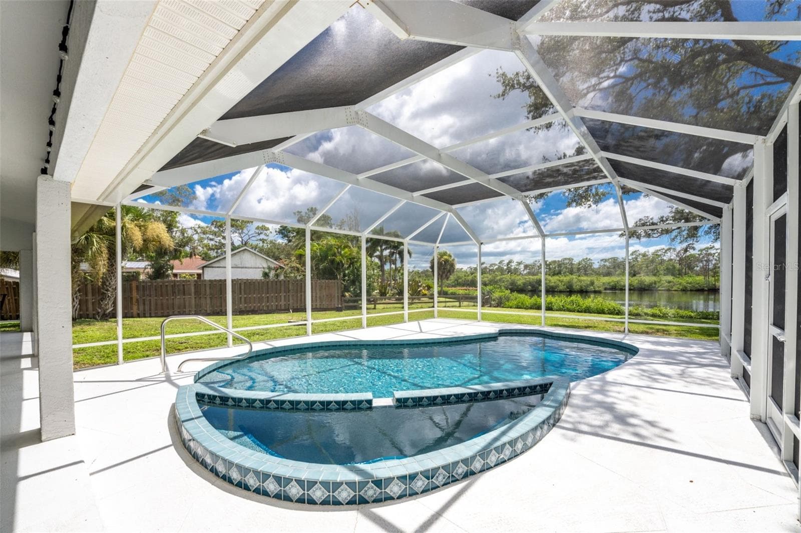 Spa is cleverly incorporated in to the swimming pool. - 200 S OXFORD DR, ENGLEWOOD