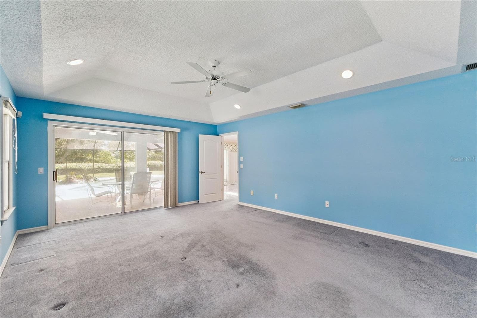 Primary Bedroom with Slider to Lanai - 23 WELLSTREAM LN, PALM COAST