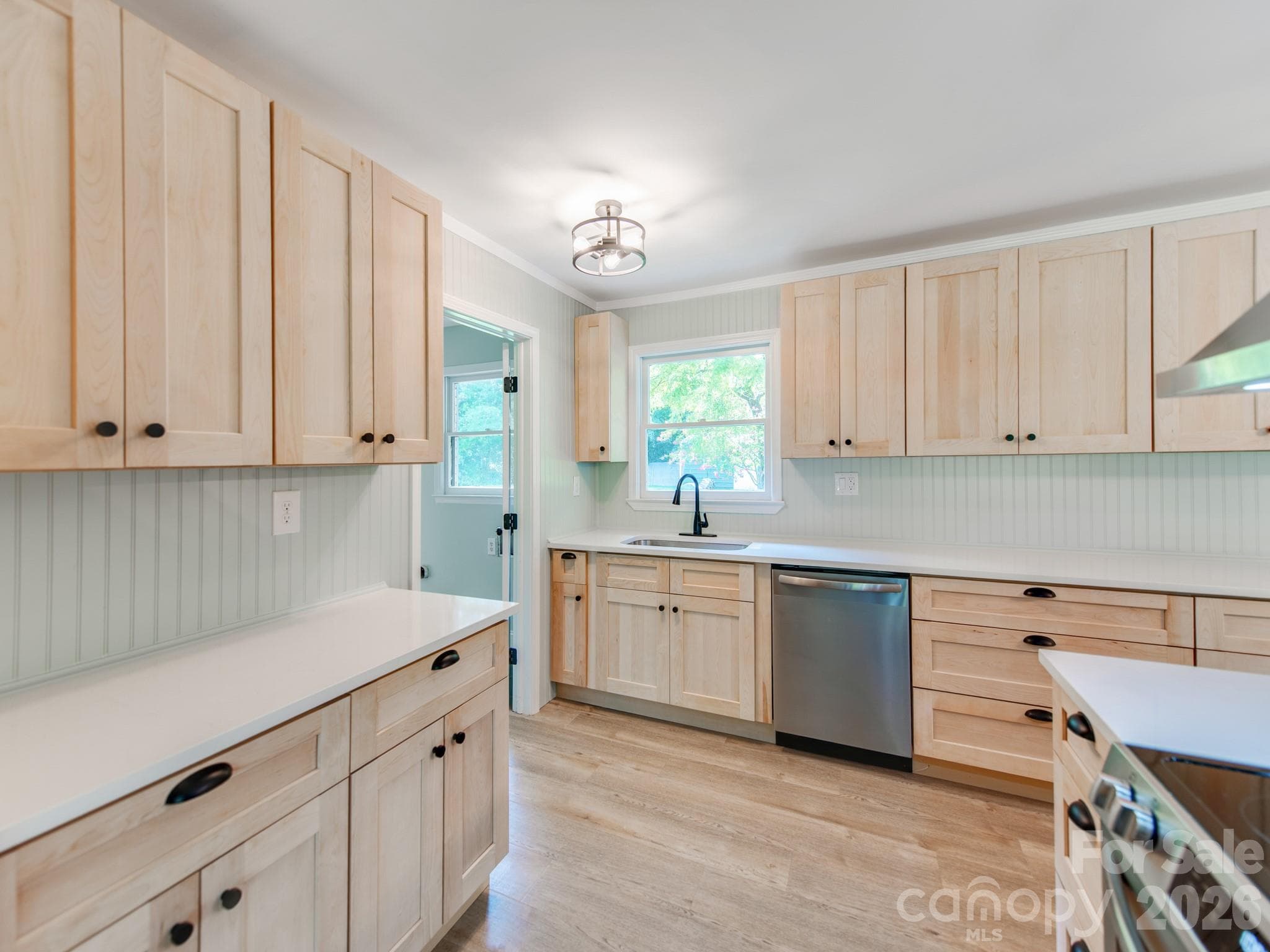 Quartz countertops compliment the new light oak cabinets - 3072 Bethany Street, Claremont
