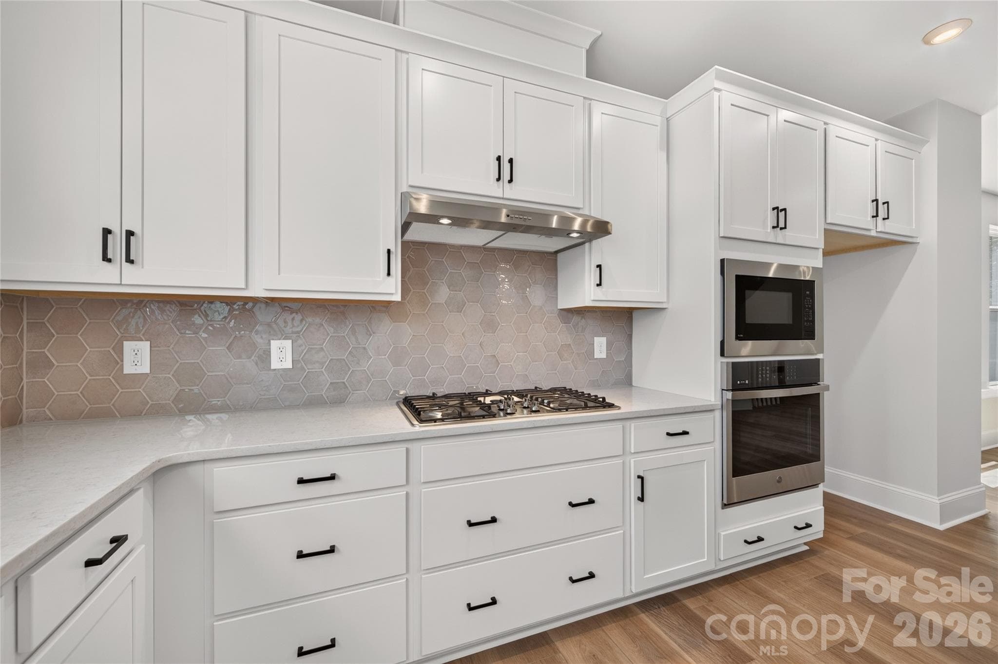 Sleek ivory backsplash - 403 Old Town Village Road, Waxhaw