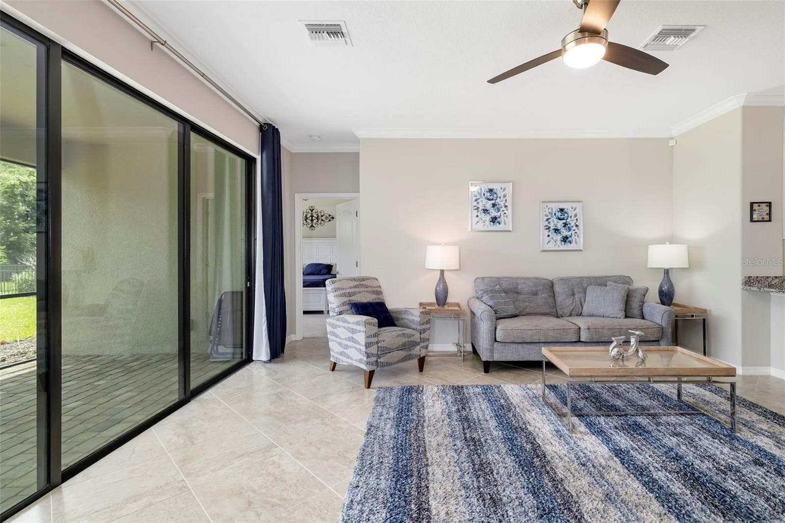 Living room and entry to the Primary Bedroom - 17927 POLO TRL, BRADENTON