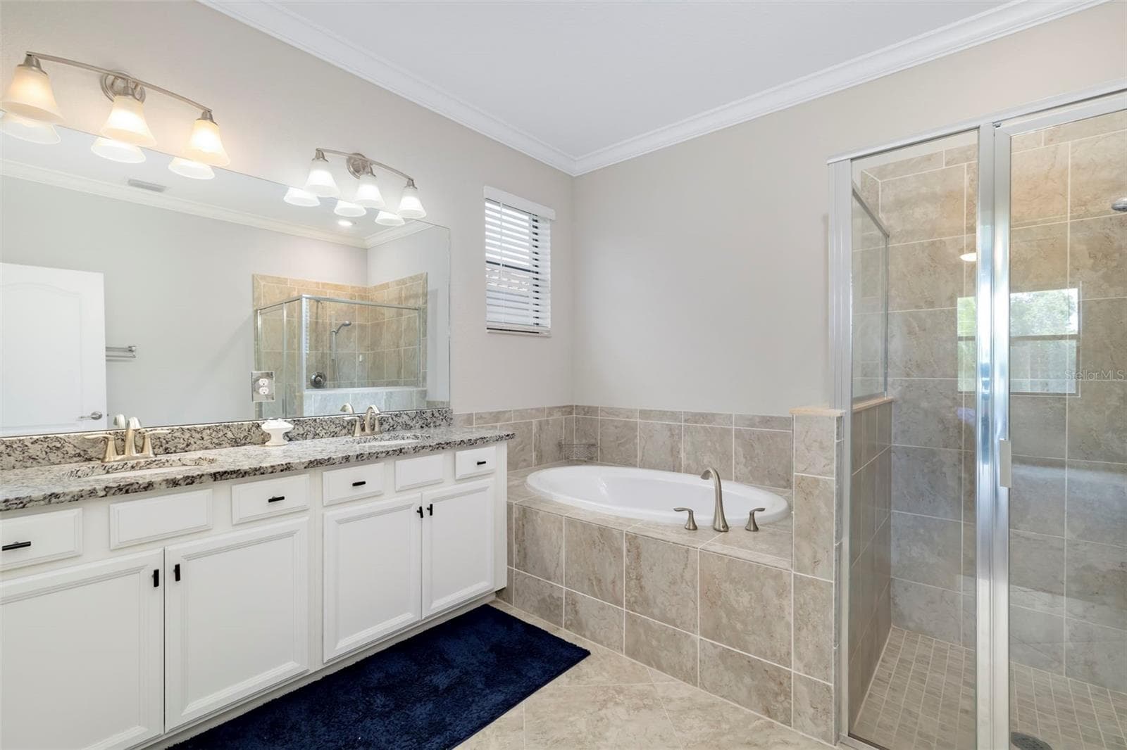 Primary Bathroom has dual sinks, soaking tub and walk-in shower - 17927 POLO TRL, BRADENTON