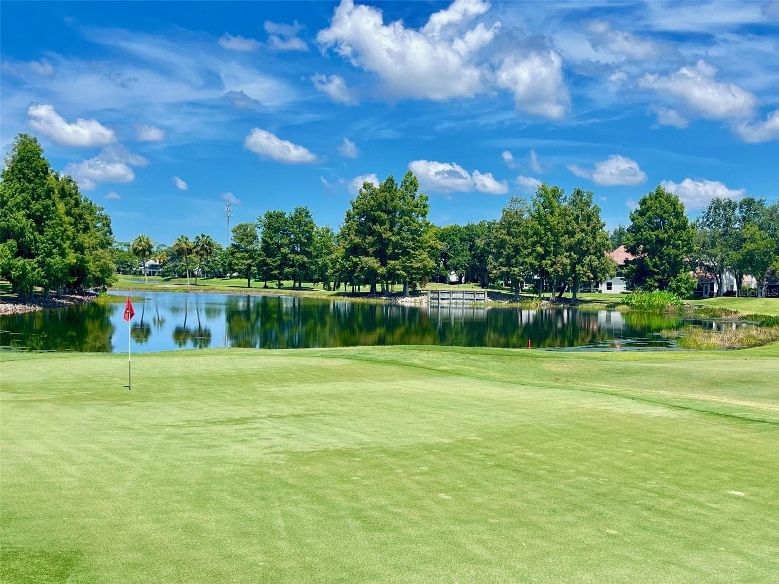 4TH GREEN AND WATER VIEW AT TARA FROM BACK ENCLOSED LANAI. - 6854 FAIRVIEW TER #6854, BRADENTON
