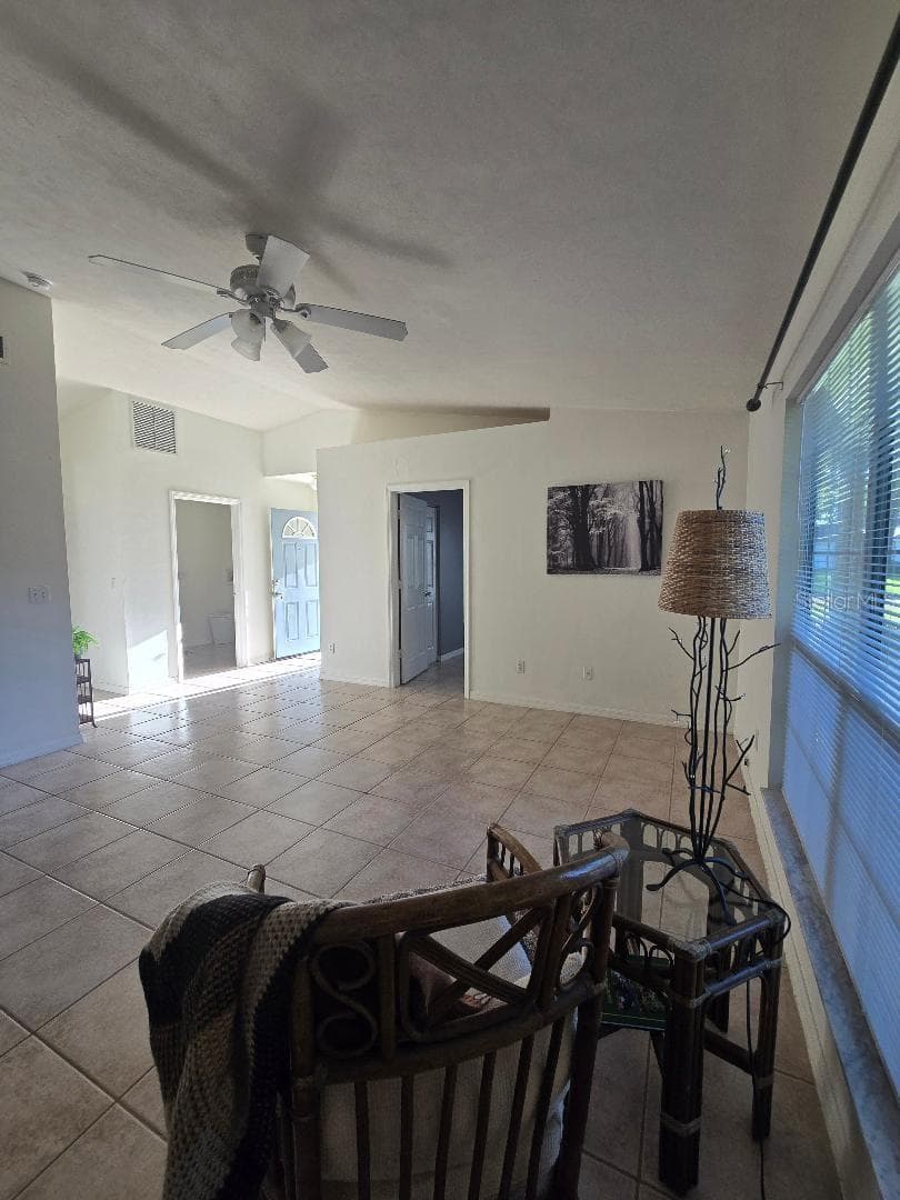 View from kitchen to open living area - 13607 NW 135 DR, ALACHUA