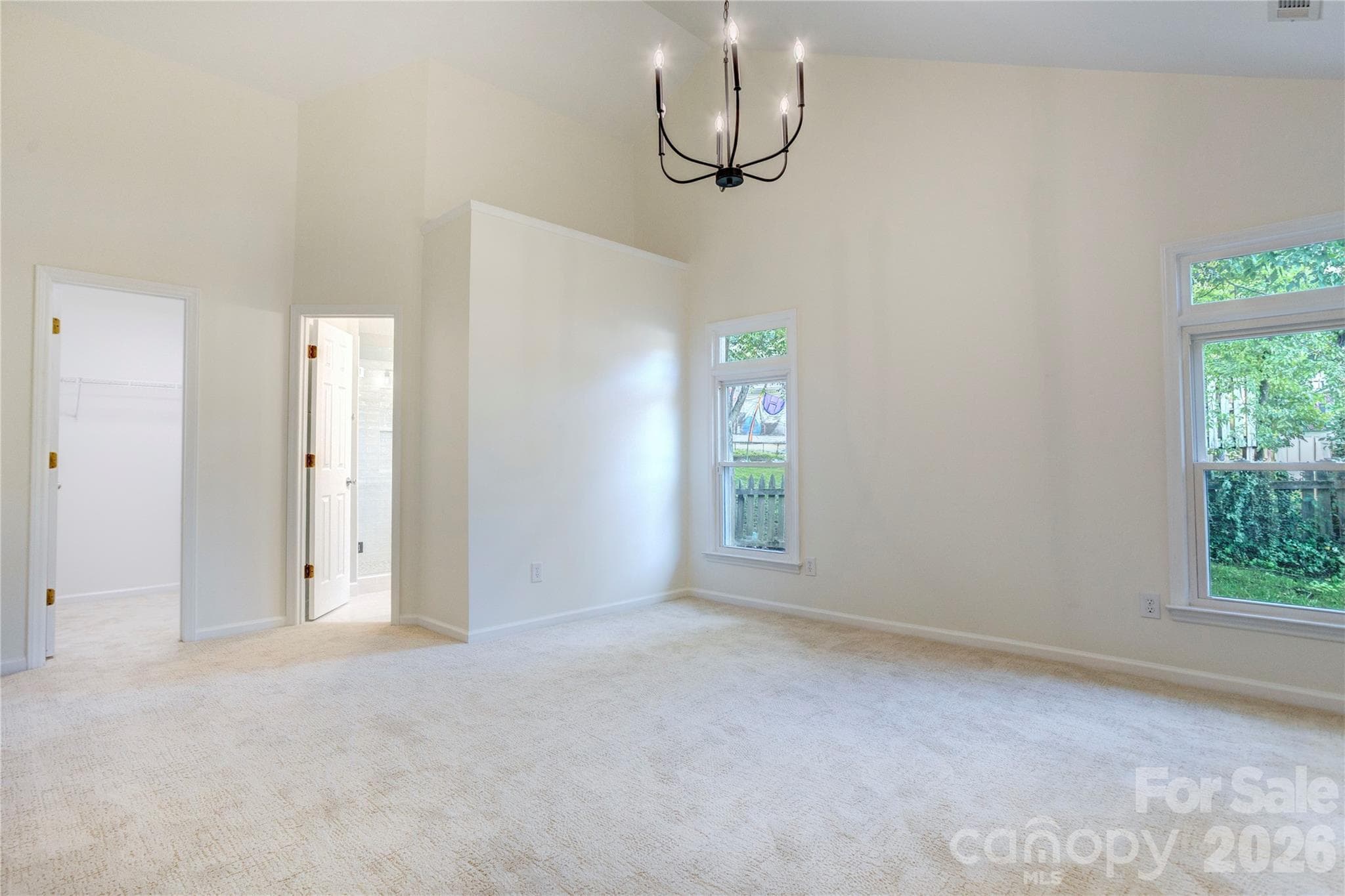 Updated primary with new lighting and plush carpet - 156 Edgewater Drive NW, Concord