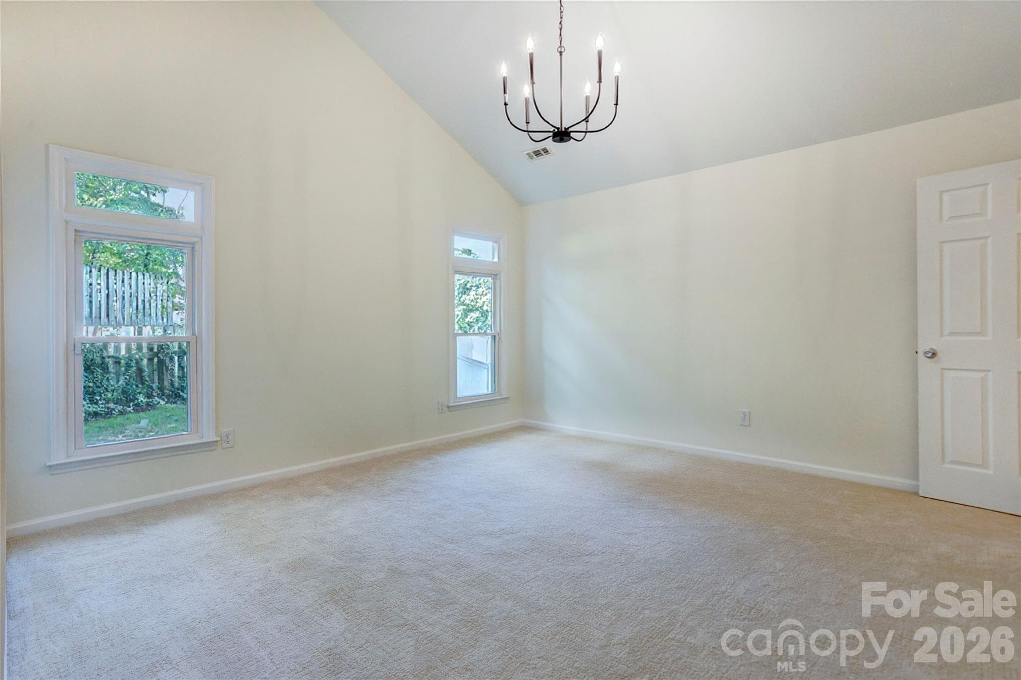 Primary bedroom with high ceilings and updated lighting - 156 Edgewater Drive NW, Concord