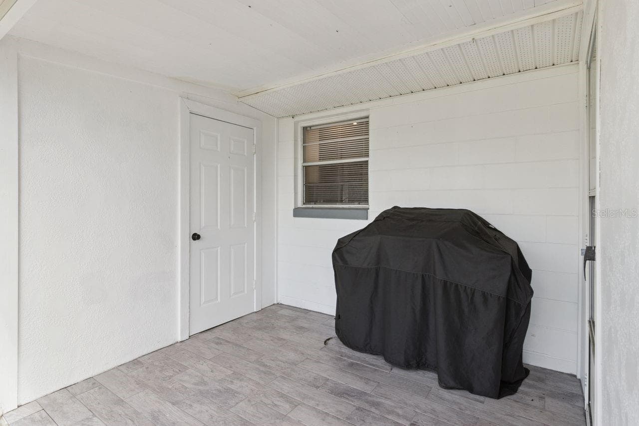 Covered porch in back - 220 ALDO DR, BABSON PARK