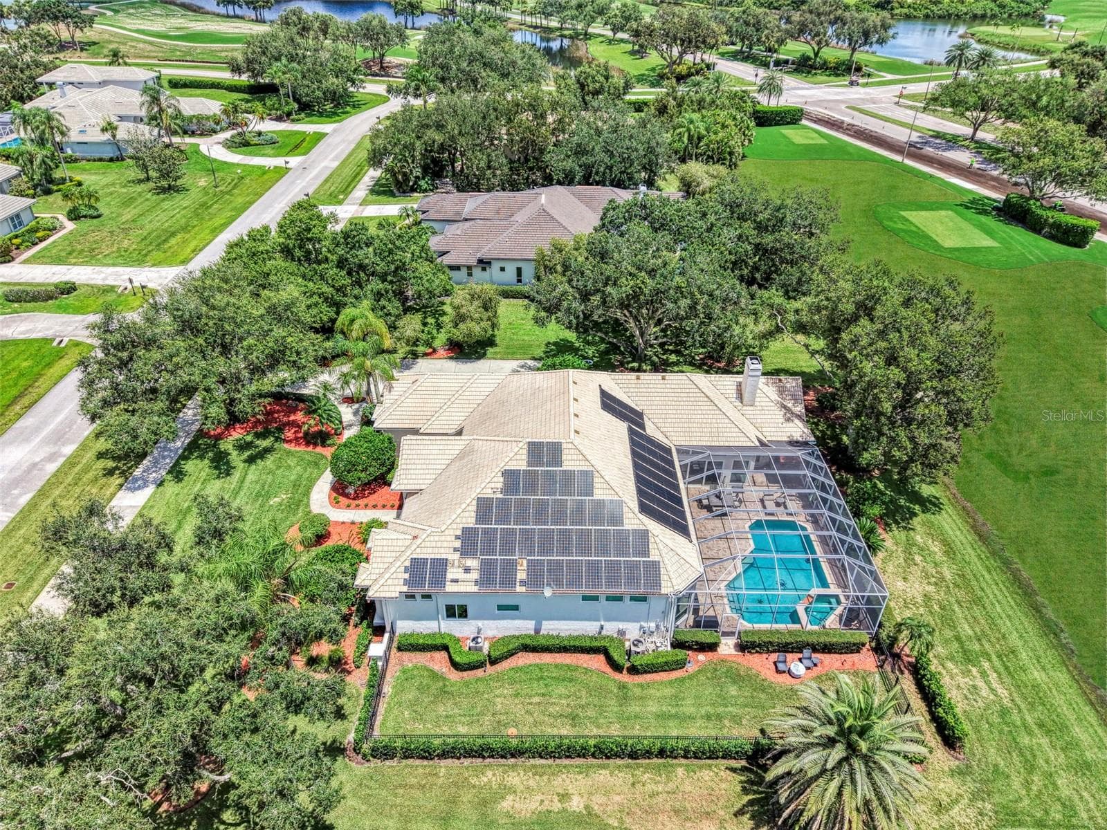 Overhead - fenced dog run, and solar panels power the home, energy stored in Tesla Powerwall - 7767 ALISTER MACKENZIE DR, SARASOTA