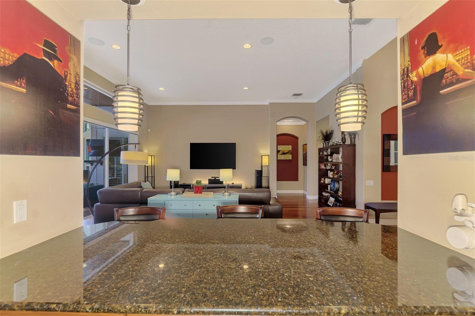 Wet bar with seamless interaction with the living room - 7767 ALISTER MACKENZIE DR, SARASOTA