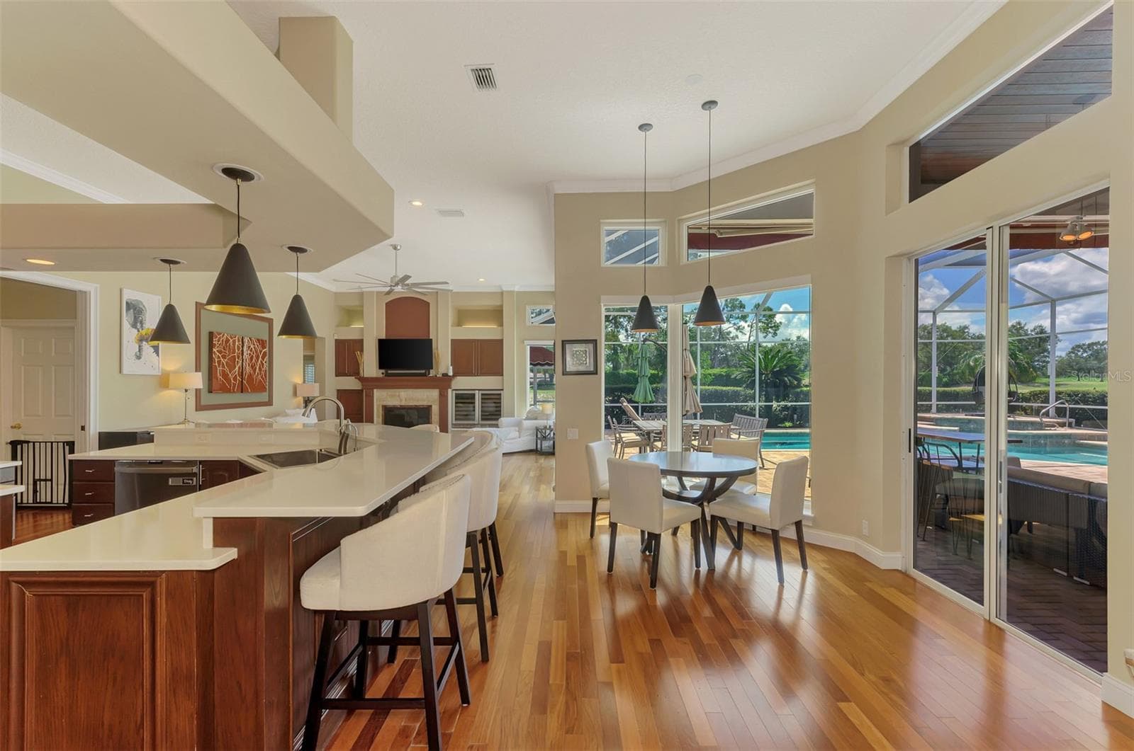 Kitchen, breakfast nook, family room combo - 7767 ALISTER MACKENZIE DR, SARASOTA