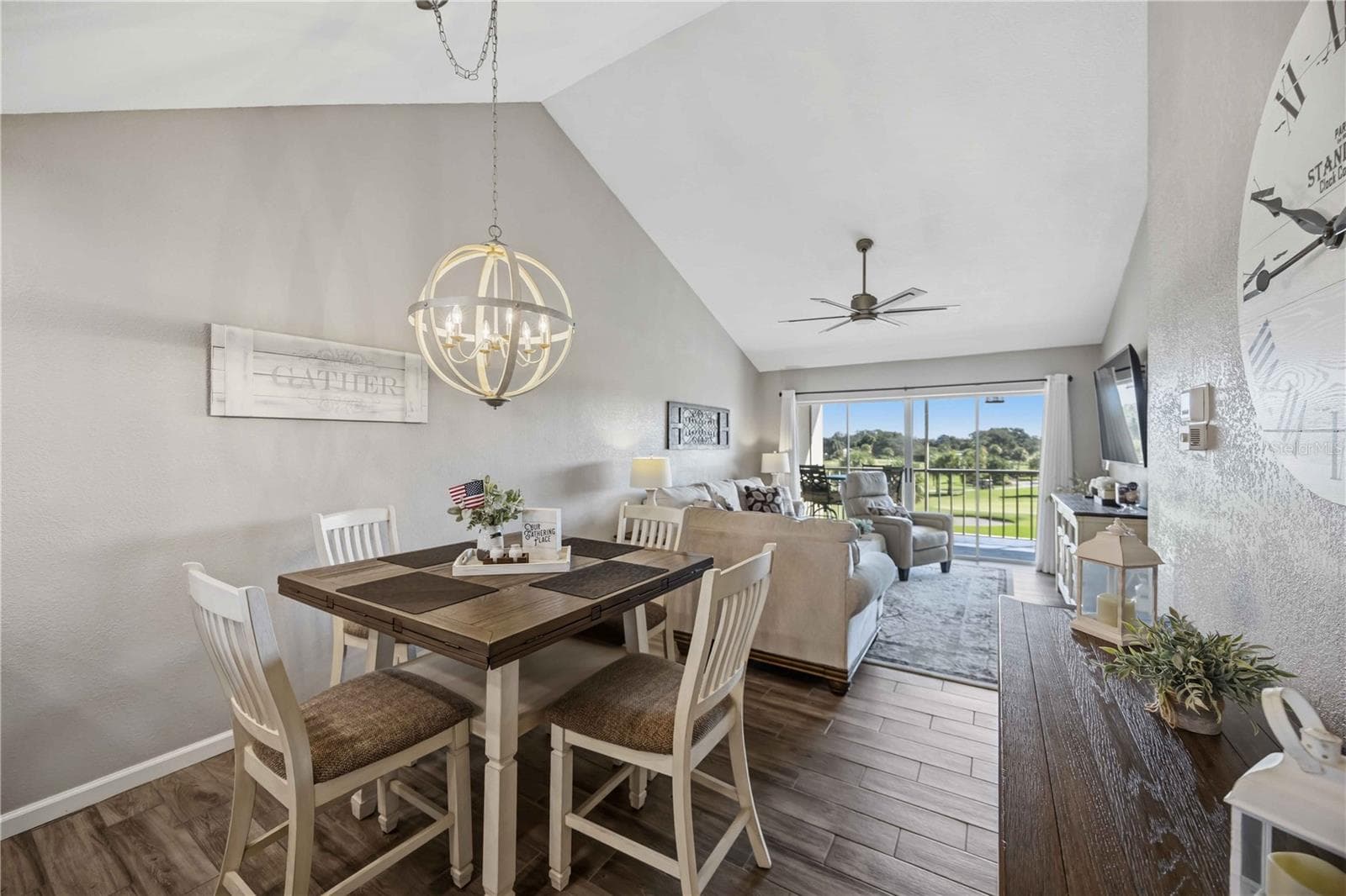 Dining area opens naturally toward the living room and outdoor views, creating an ideal setting for relaxed entertaining. - 406 CERROMAR CIR N #328, VENICE
