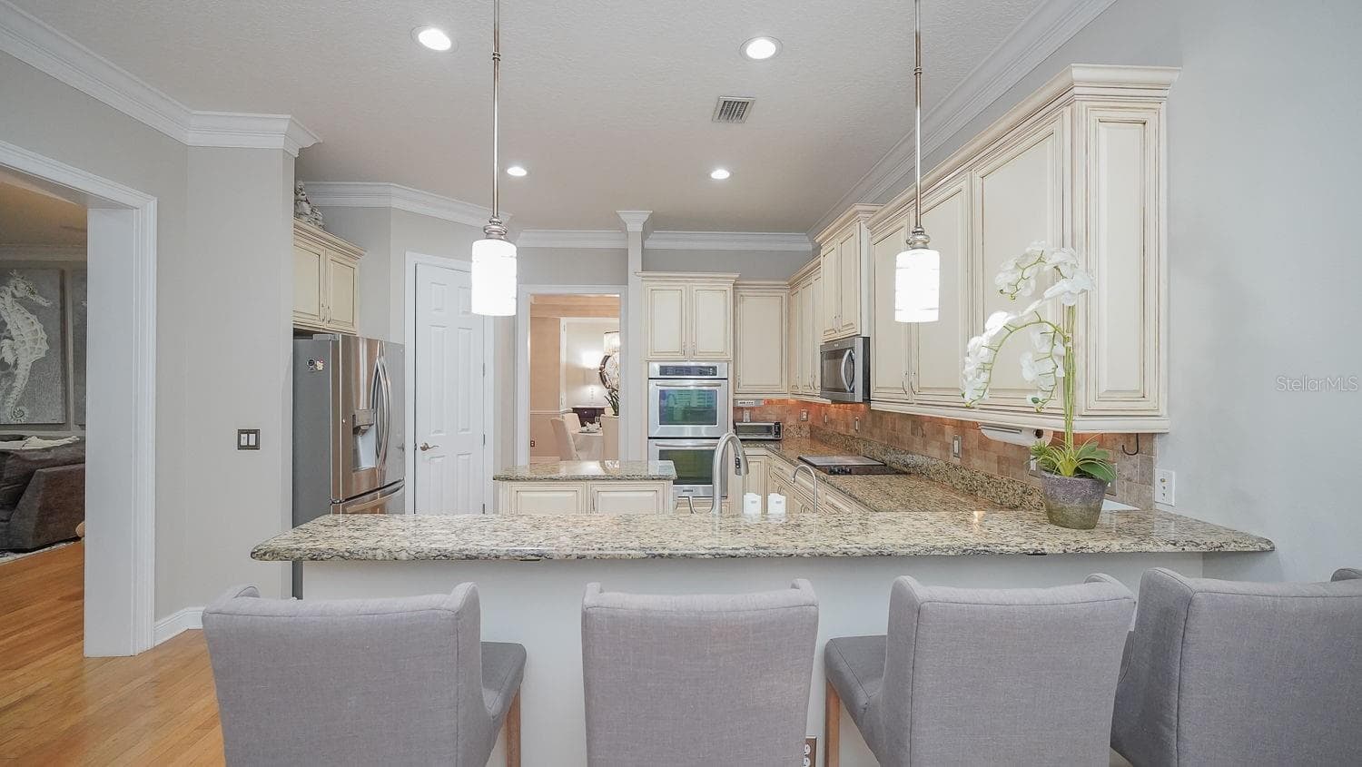 View from eat in area into large kitchen - 116 S HESPERIDES ST, TAMPA