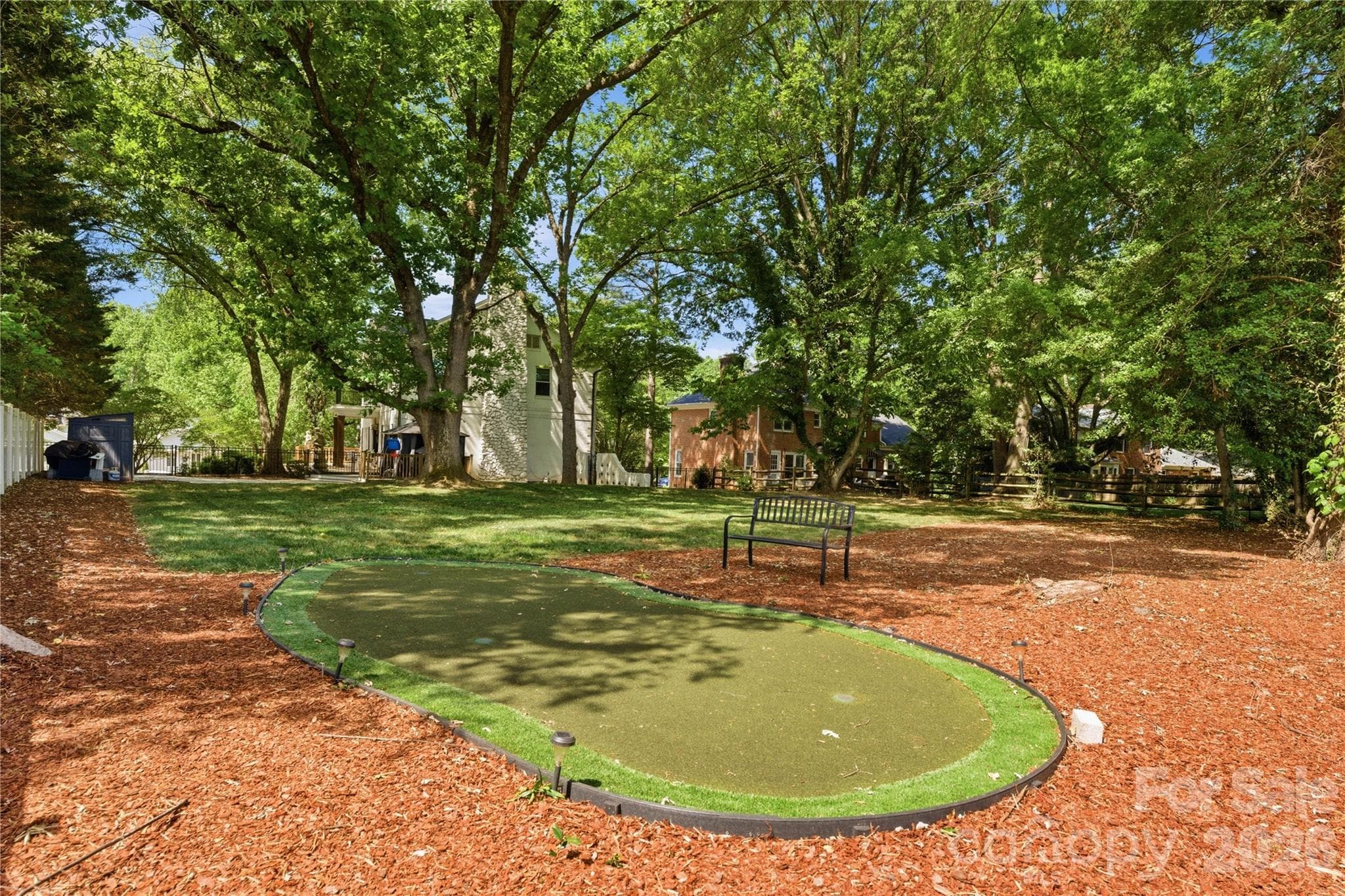 Private putting green makes the backyard even more fun! - Charlotte
