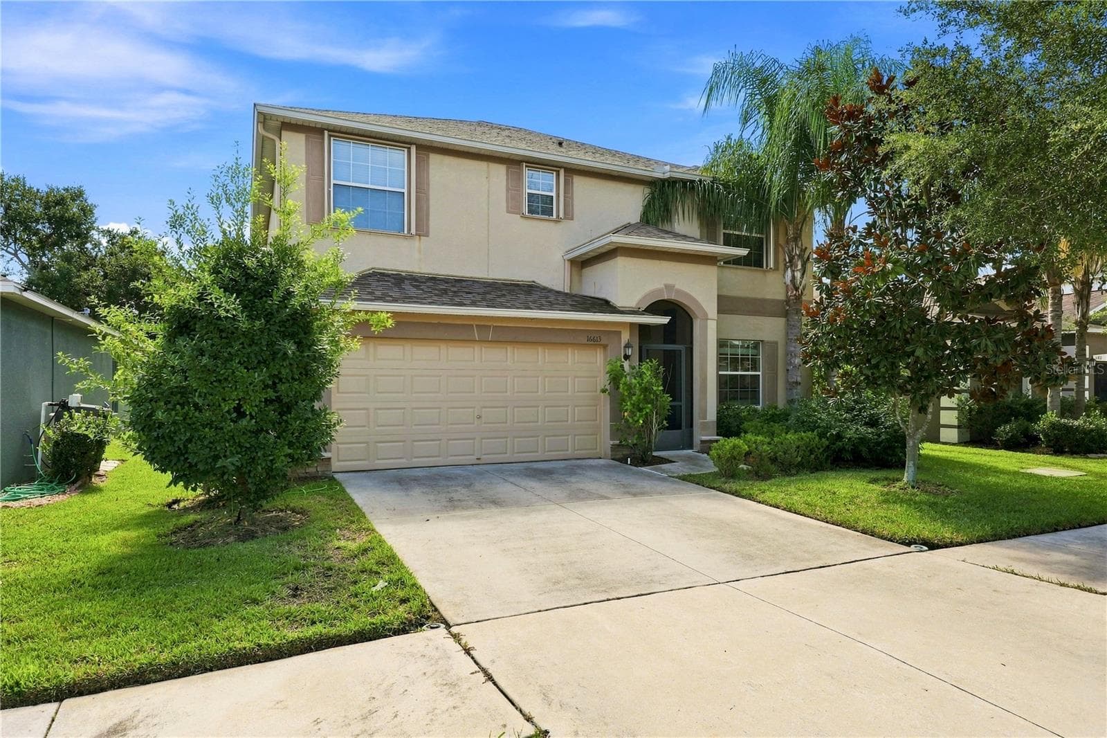 Ample driveway space for over 4 cars - 16613 MYRTLE SAND DR, WIMAUMA