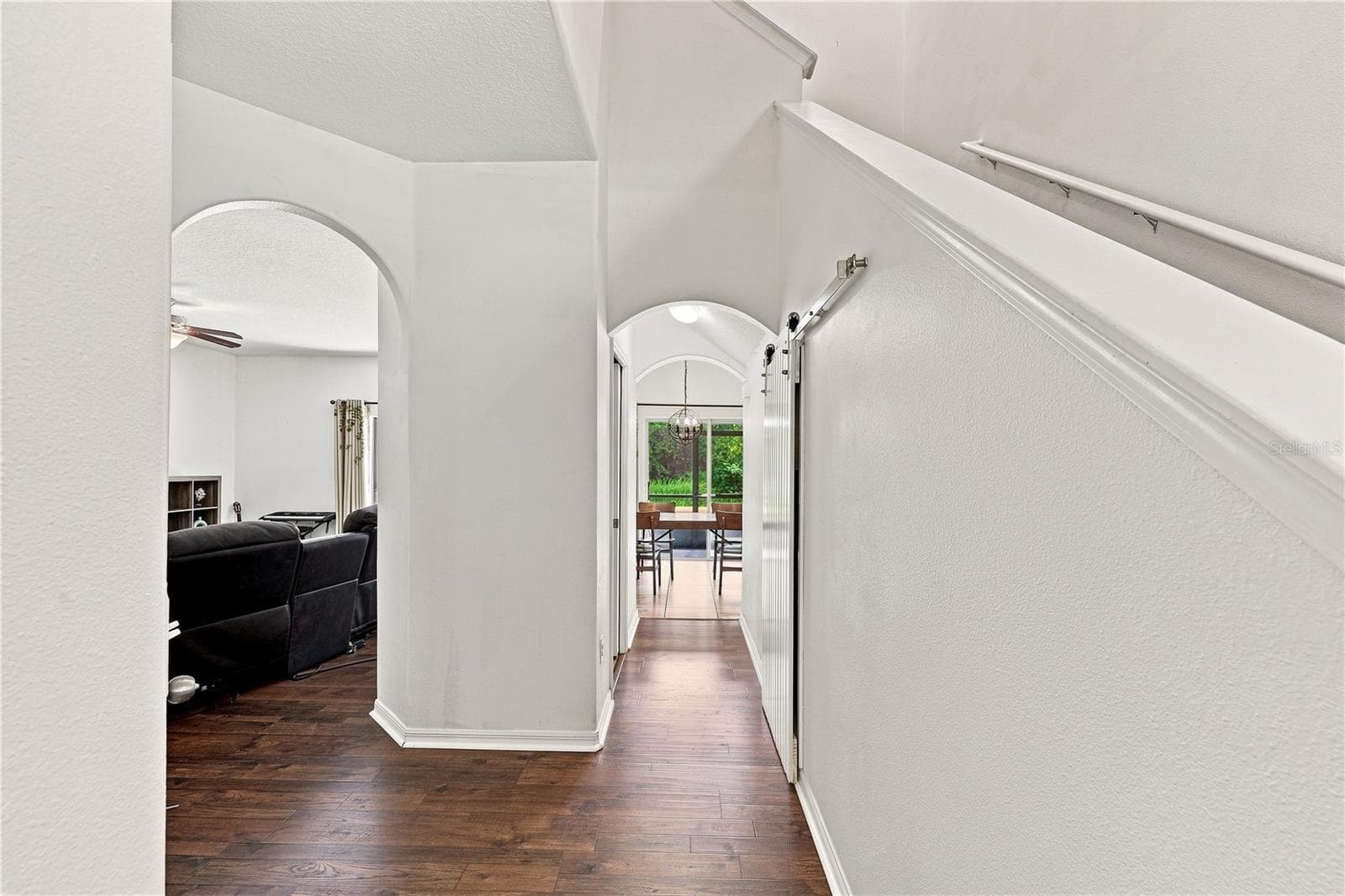 Smartly arched hallways delineate living spaces - 16613 MYRTLE SAND DR, WIMAUMA