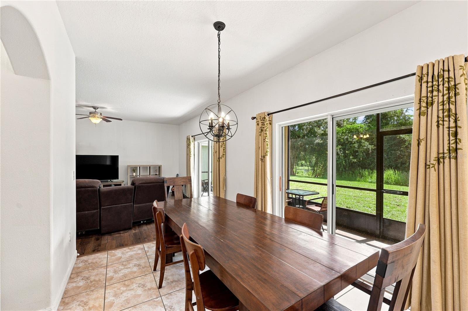 An enticing view to the large backyard - 16613 MYRTLE SAND DR, WIMAUMA