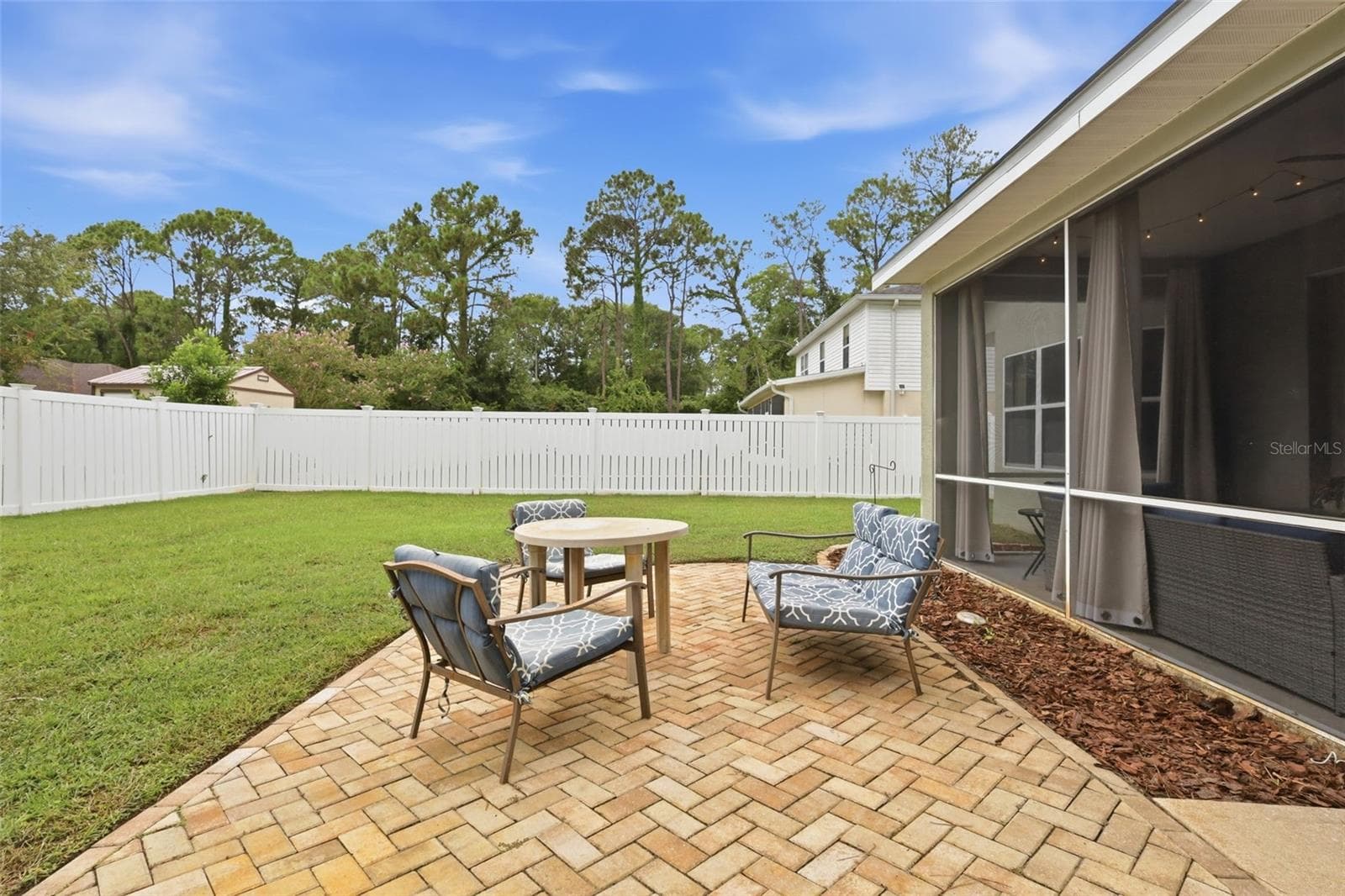 Barbecue area in backyard is great for entertaining...or enjoying the bright stars! - 96 PARKVIEW DR, PALM COAST