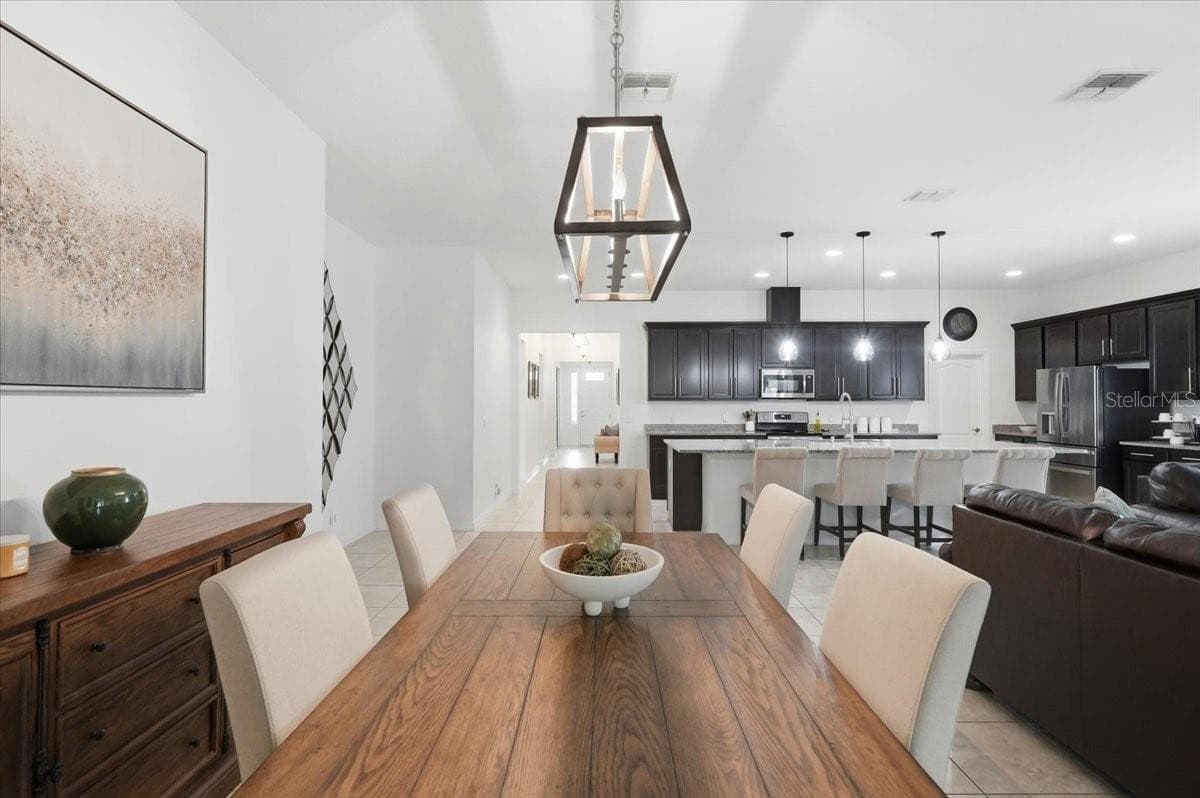 Beautifully defined spaces give the heart of the home an unmistakable sense of scale and sophistication. - 4791 RIVERWALK DR, ST CLOUD