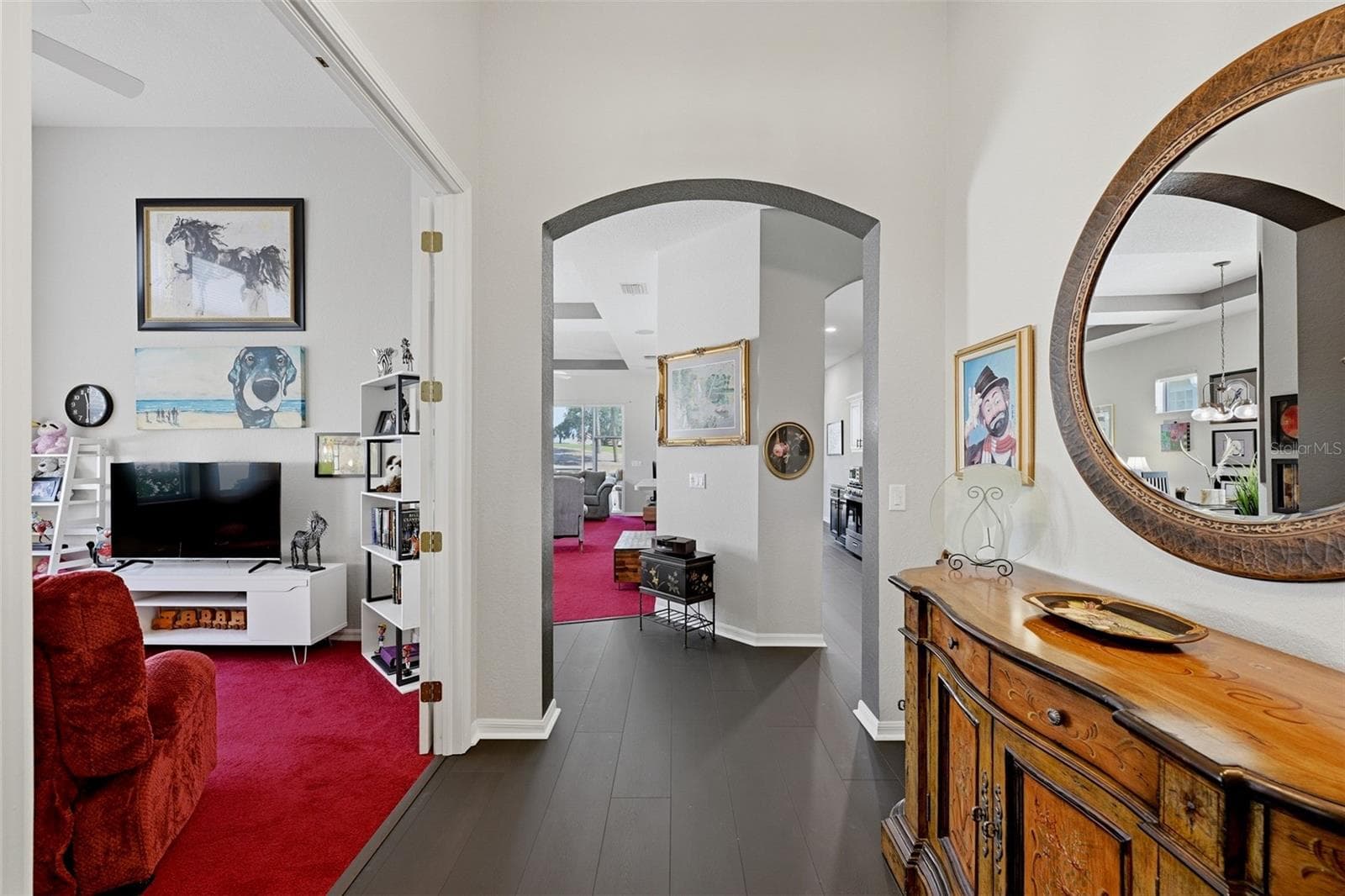 FOYER WITH VIEW INTO THE DEN WITH DOUBLE FRENCH DOORS AND LOOKING INTO THE GREAT ROOM AND KITCHEN - 441 NOBLE FAIRE DR, SUN CITY CENTER
