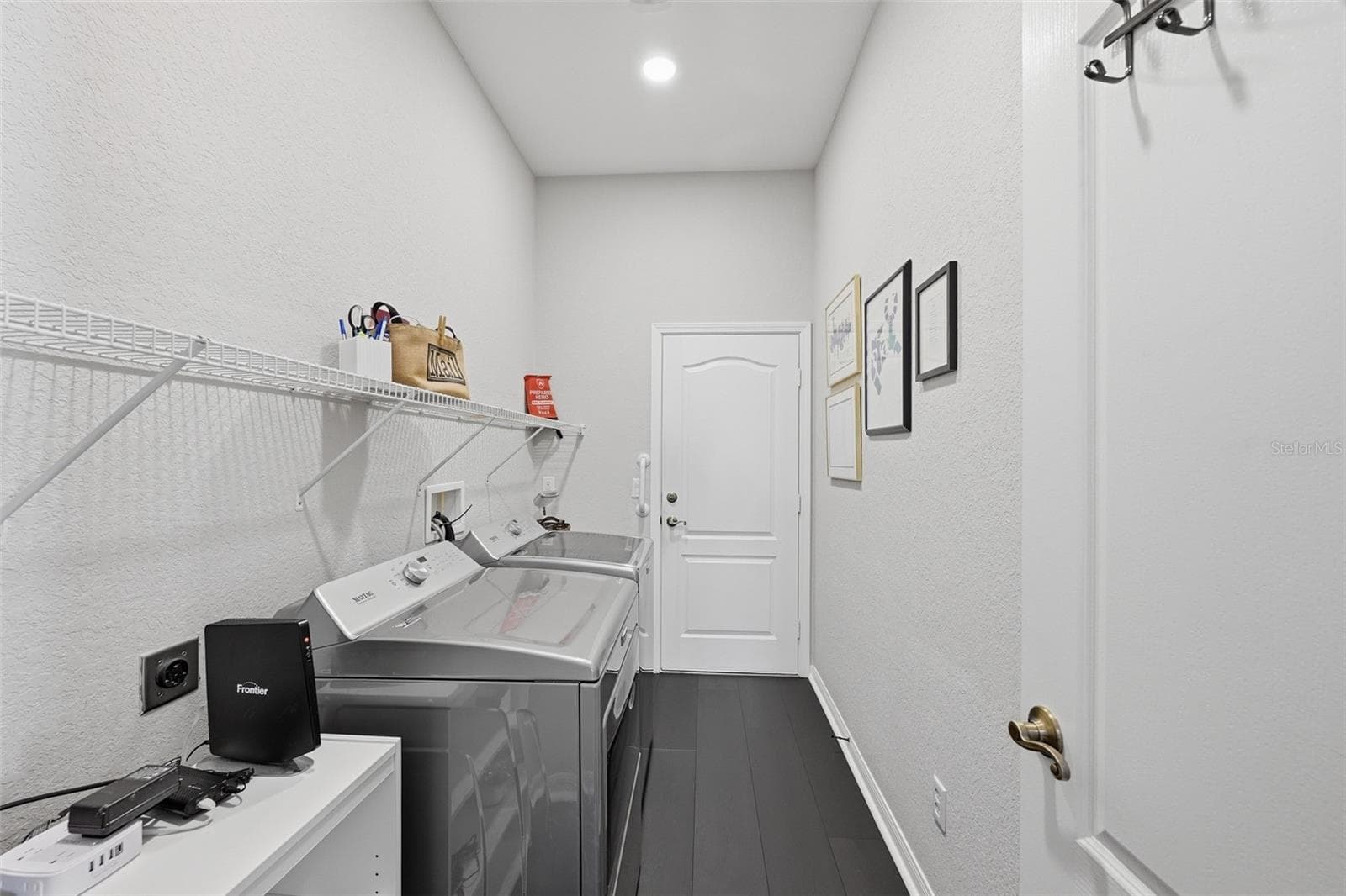 LAUNDRY ROOM OUT TO THE GARAGE - 441 NOBLE FAIRE DR, SUN CITY CENTER
