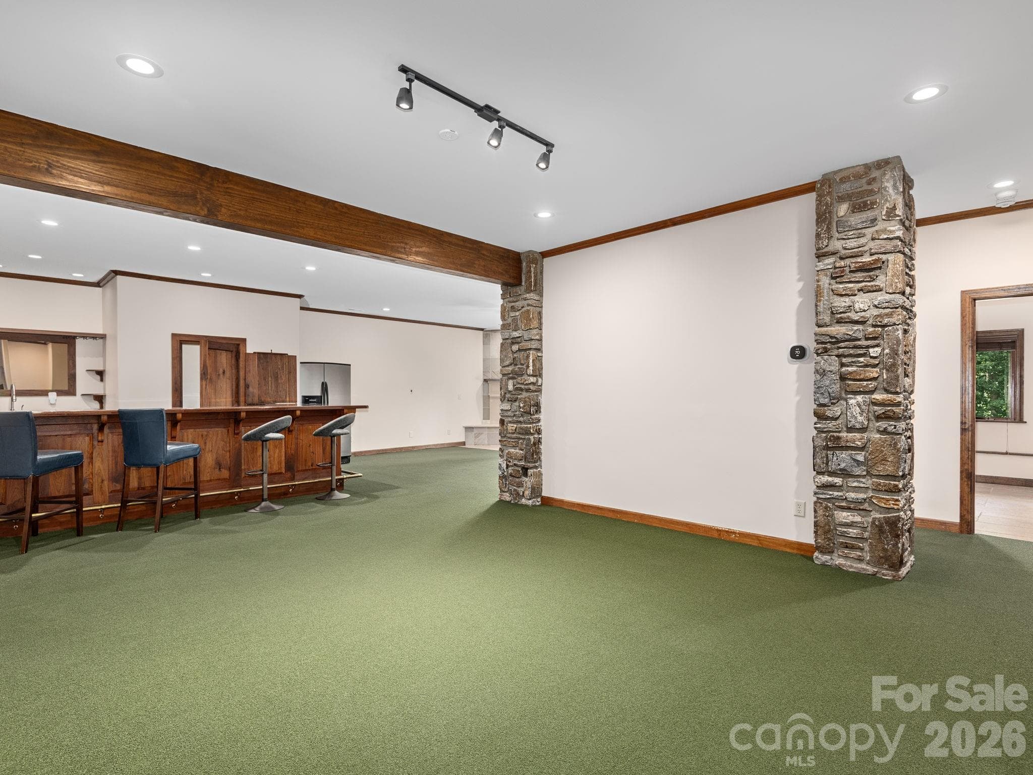 Full finished basement. Original tile is under the golf carpet. 'Carpet' is not adhered to the floor, easily removable. - 248 Wisdom Cove Road, Flat Rock