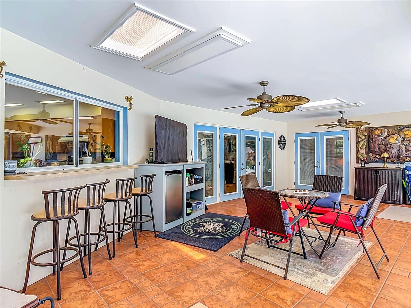 Covered lanai with slider window to the kitchen for easy access for food and drinks pass through while relaxing by the pool. - 2269 COUNTRY CLUB DR, DELAND