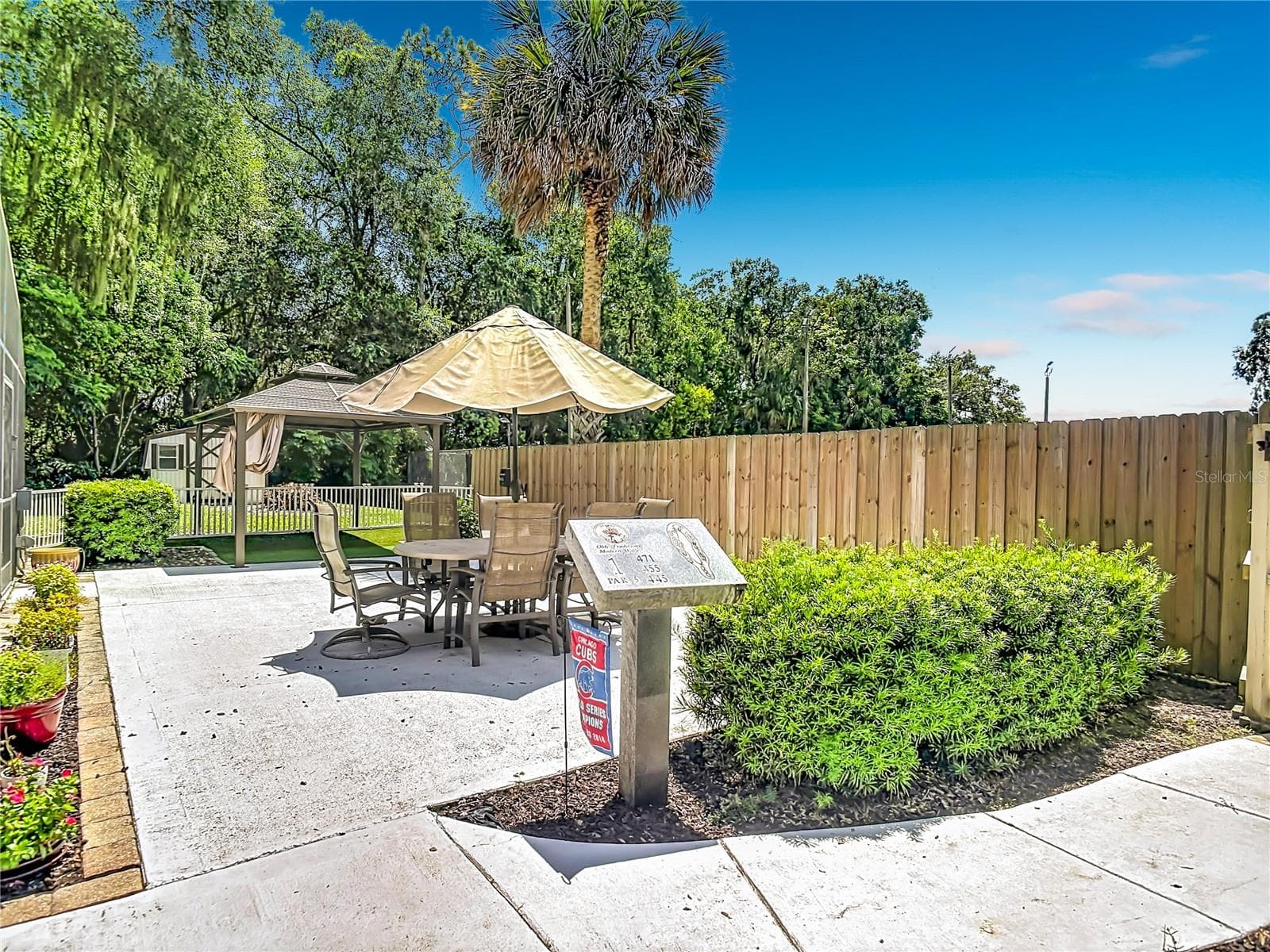 fenced in patio off the screened pool - 2269 COUNTRY CLUB DR, DELAND