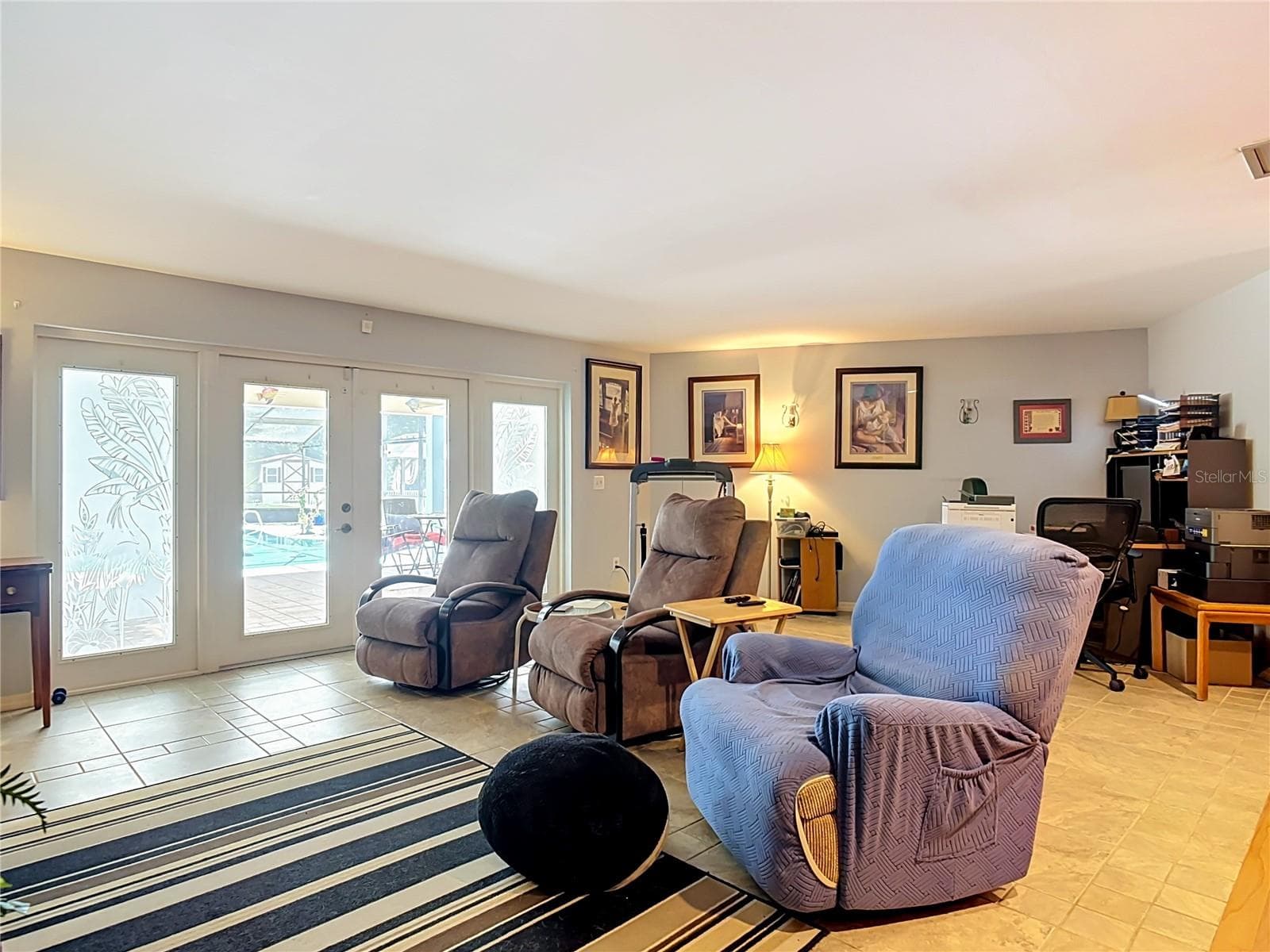 family room with french doors to the pool and lanai - 2269 COUNTRY CLUB DR, DELAND