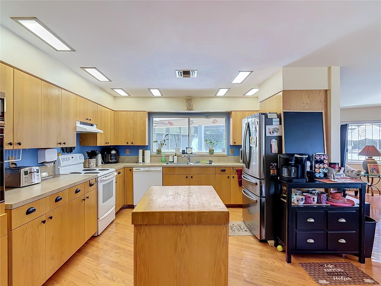 kitchen with butcher block island - 2269 COUNTRY CLUB DR, DELAND