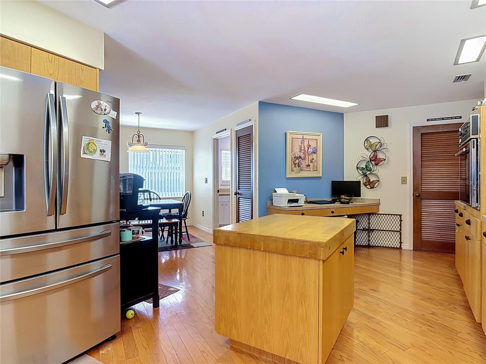 kitchen opens to dining room - 2269 COUNTRY CLUB DR, DELAND
