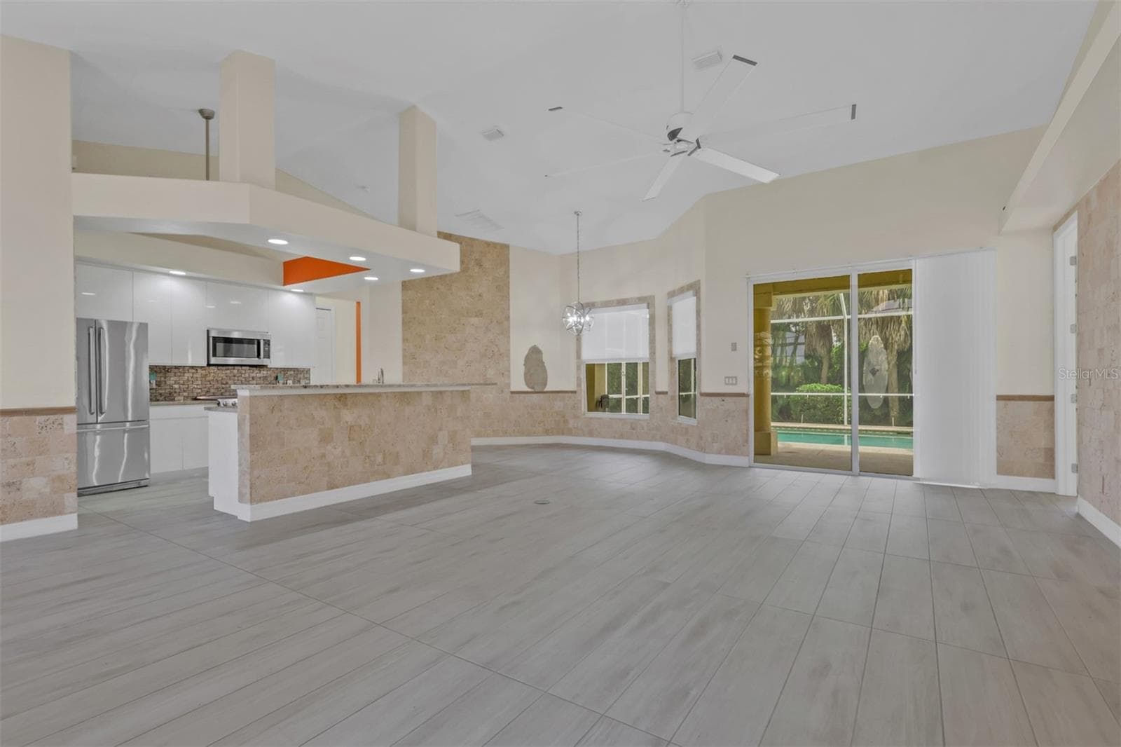Family room open to Kitchen area - 8596 SOUTHWIND BAY CIR, FORT MYERS