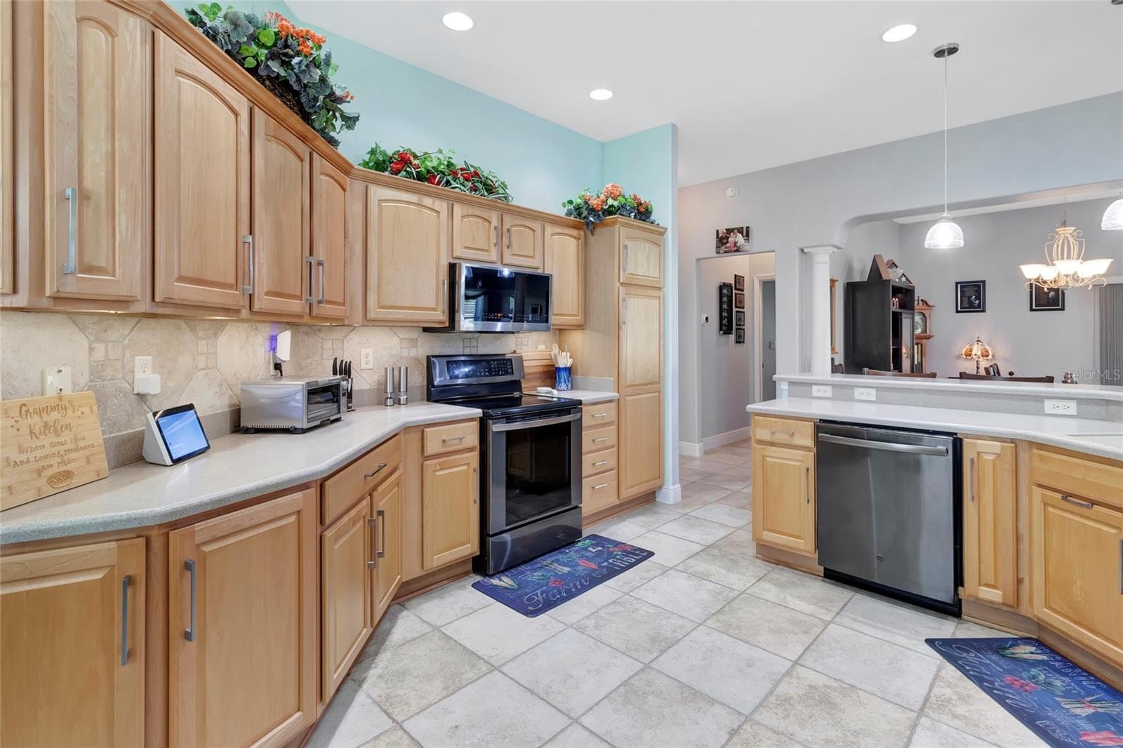 Solid surface countertops and all wood cabinets. - 4190 COUNTY ROAD 121D, WILDWOOD