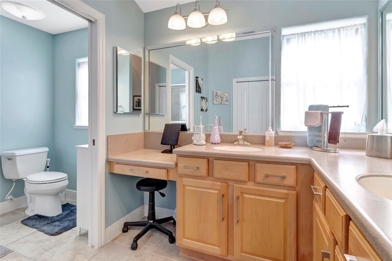 En suite bathroom and all tile floors in primary bathroom. - 4190 COUNTY ROAD 121D, WILDWOOD