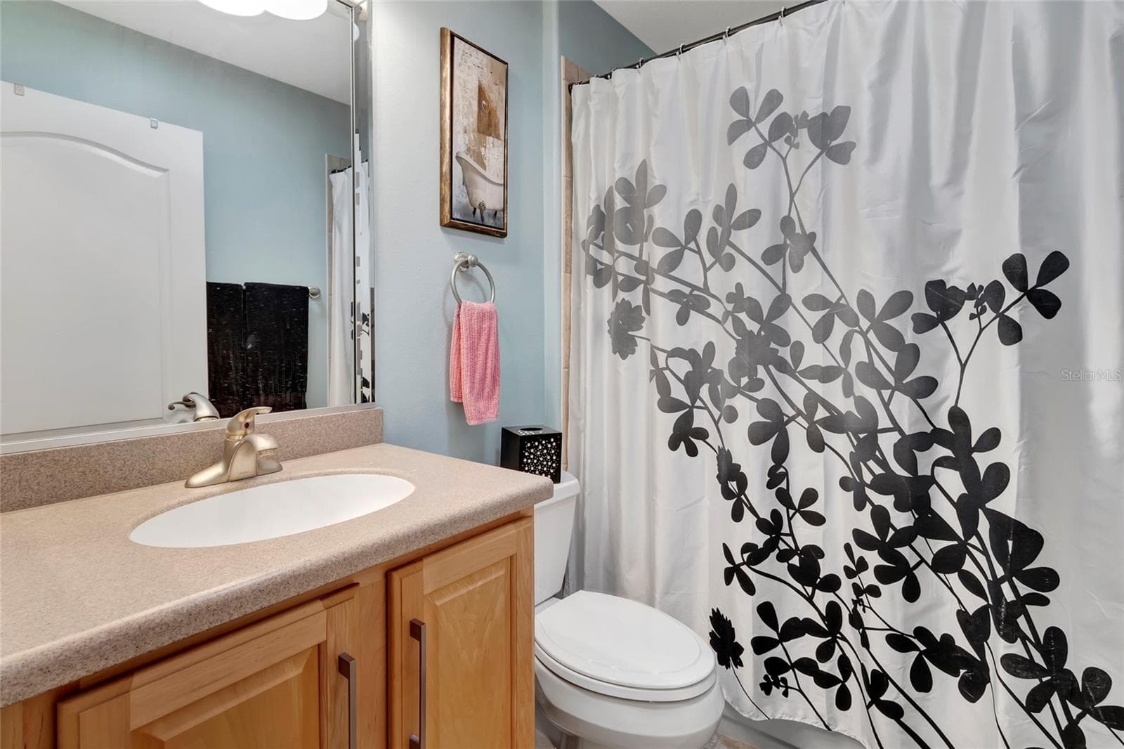 Guest bathroom with solid surface counter tops and step in tub and shower. - 4190 COUNTY ROAD 121D, WILDWOOD