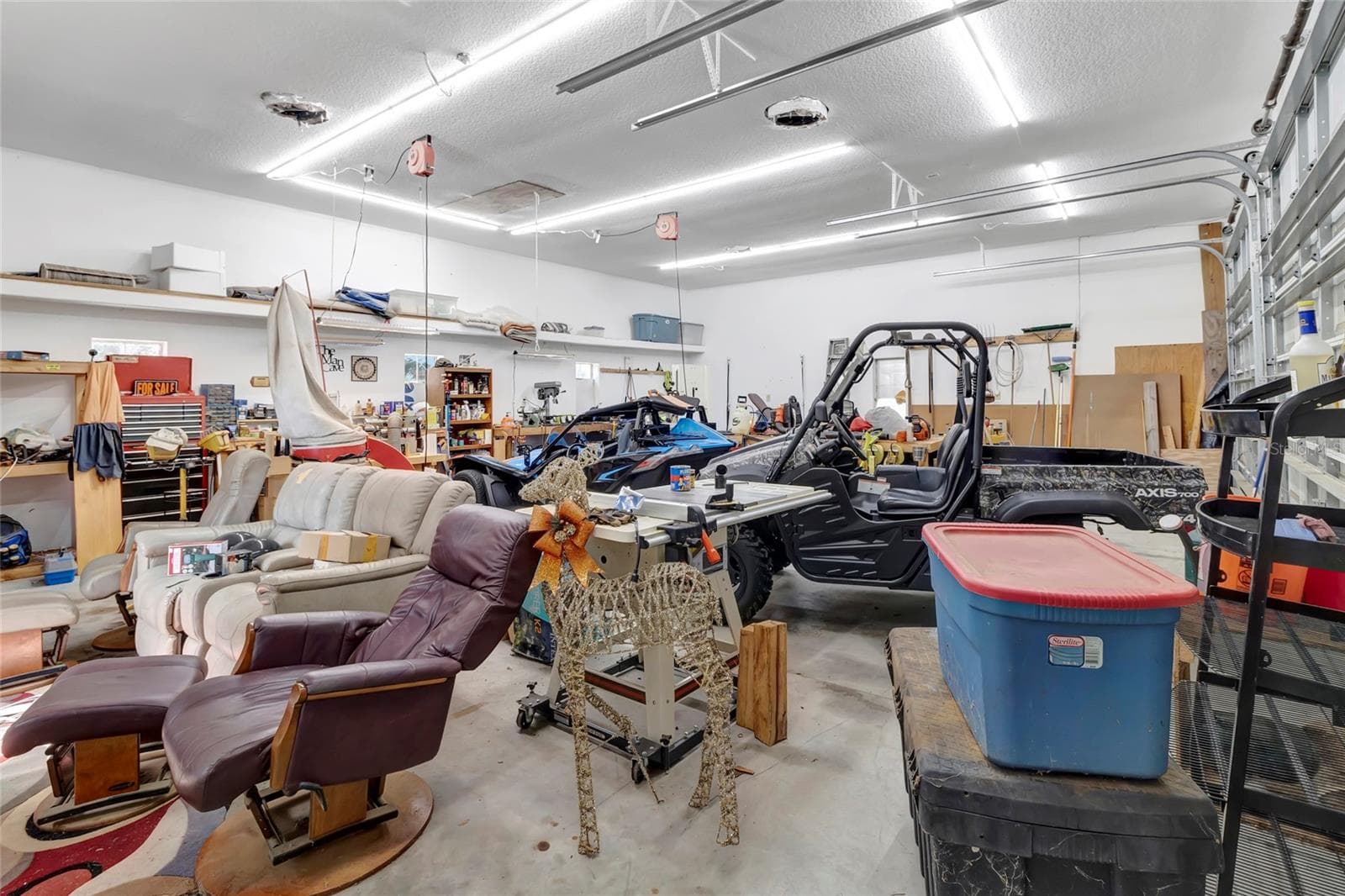 Completely insulated and air conditioned with LED lighting and all ready for a car lift to be installed!! Plenty of room for all your toys!! - 4190 COUNTY ROAD 121D, WILDWOOD