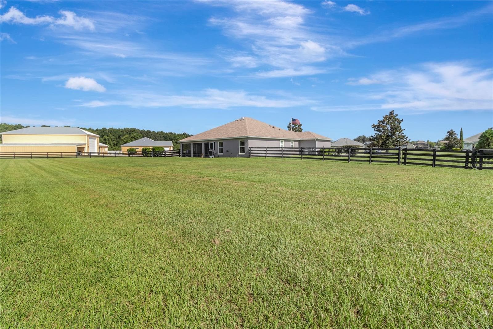 Completely open lot and fenced in with a board and wire fence. - 4190 COUNTY ROAD 121D, WILDWOOD