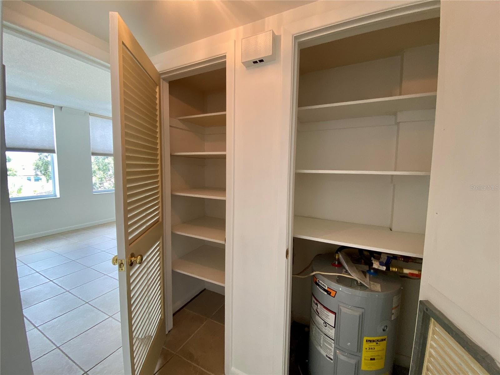 Linen and water heater in hallway 2nd bedroom - 2403 S ARDSON PL #402B, TAMPA