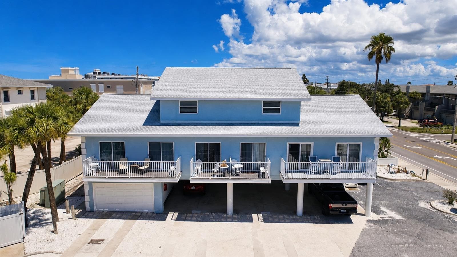 Condo is Above Garage, Left Side. Laundry and storage under. Stair entry on both sides. - 1802 GULF BLVD #8, INDIAN ROCKS BEACH