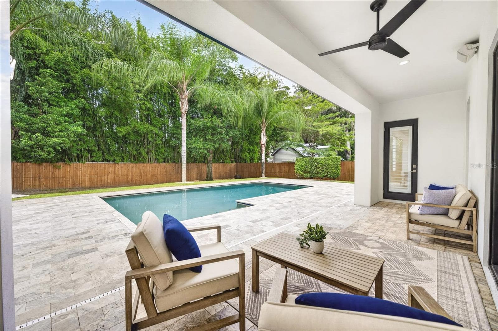 Rear lanai overlooking the private backyard/pool - 2343 VERSAILLES AVE, WINTER PARK