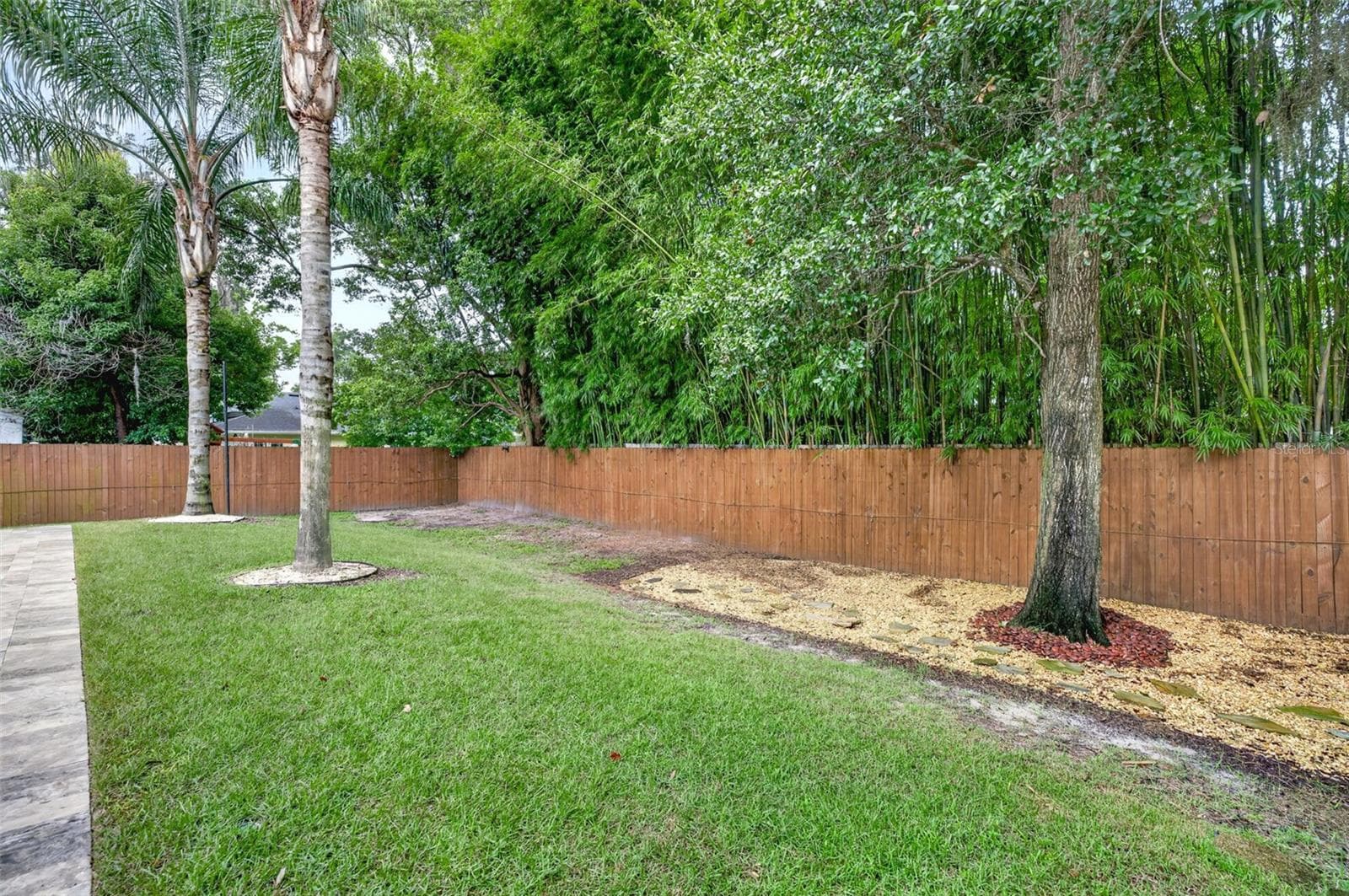 Room for pets to play or firepit area, with bamboo for added privacy - 2343 VERSAILLES AVE, WINTER PARK