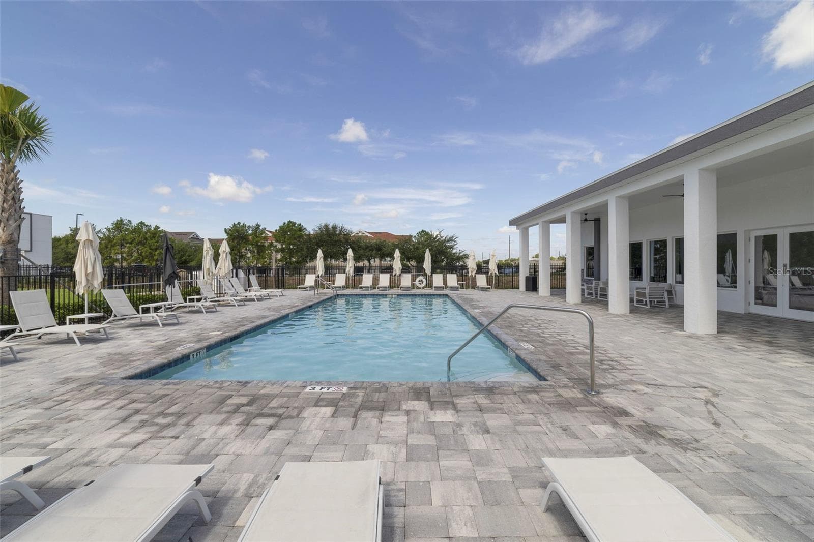 This home is right across the street from the community pool. - 340 FAMAGUSTA DR, DAVENPORT