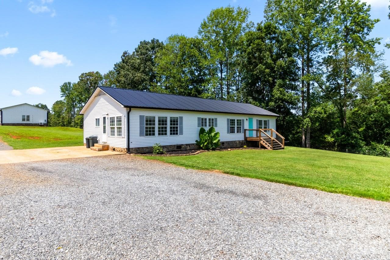 Front view of home - Showing great trees and concrete parking pad - 393 Cedar Grove Church Road, Vale