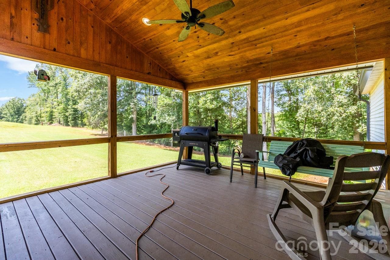 Screen room. Notice the ceilings and Trex floors - 393 Cedar Grove Church Road, Vale