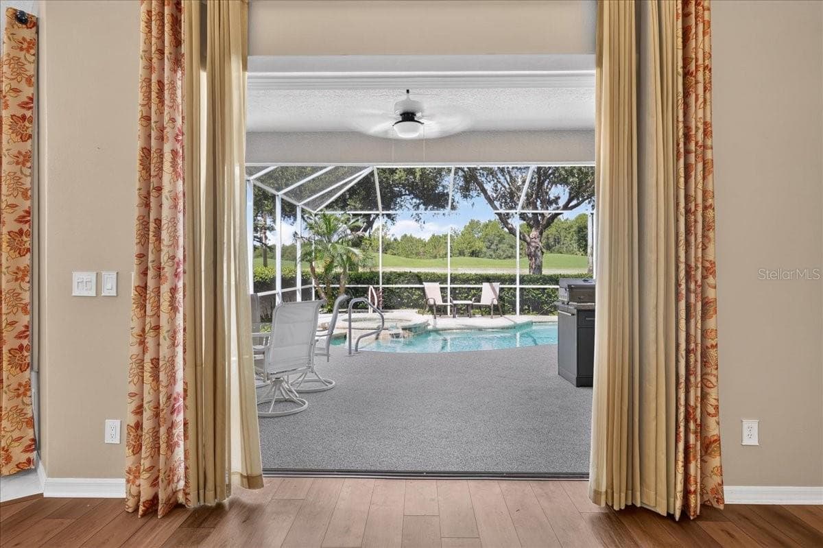 view from living room. triple pocket sliders - 5 CAPTIVA AT LIONSPAW, DAYTONA BEACH