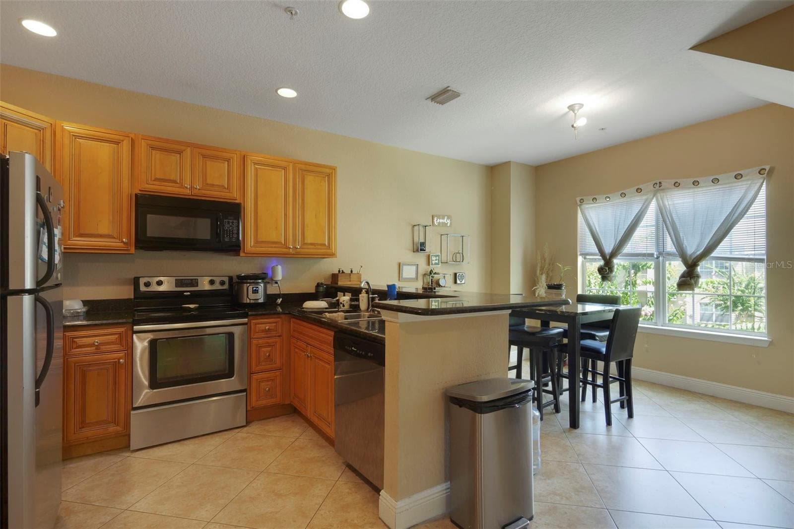 Kitchen/Dining Area. - 3719 S LAKE ORLANDO PKWY #2, ORLANDO
