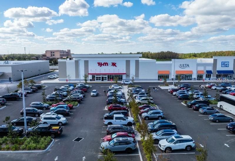 Running errands is a breeze with Poinciana Lakes Plaza 15 minutes from home. - 203 HYACINTH CT, POINCIANA