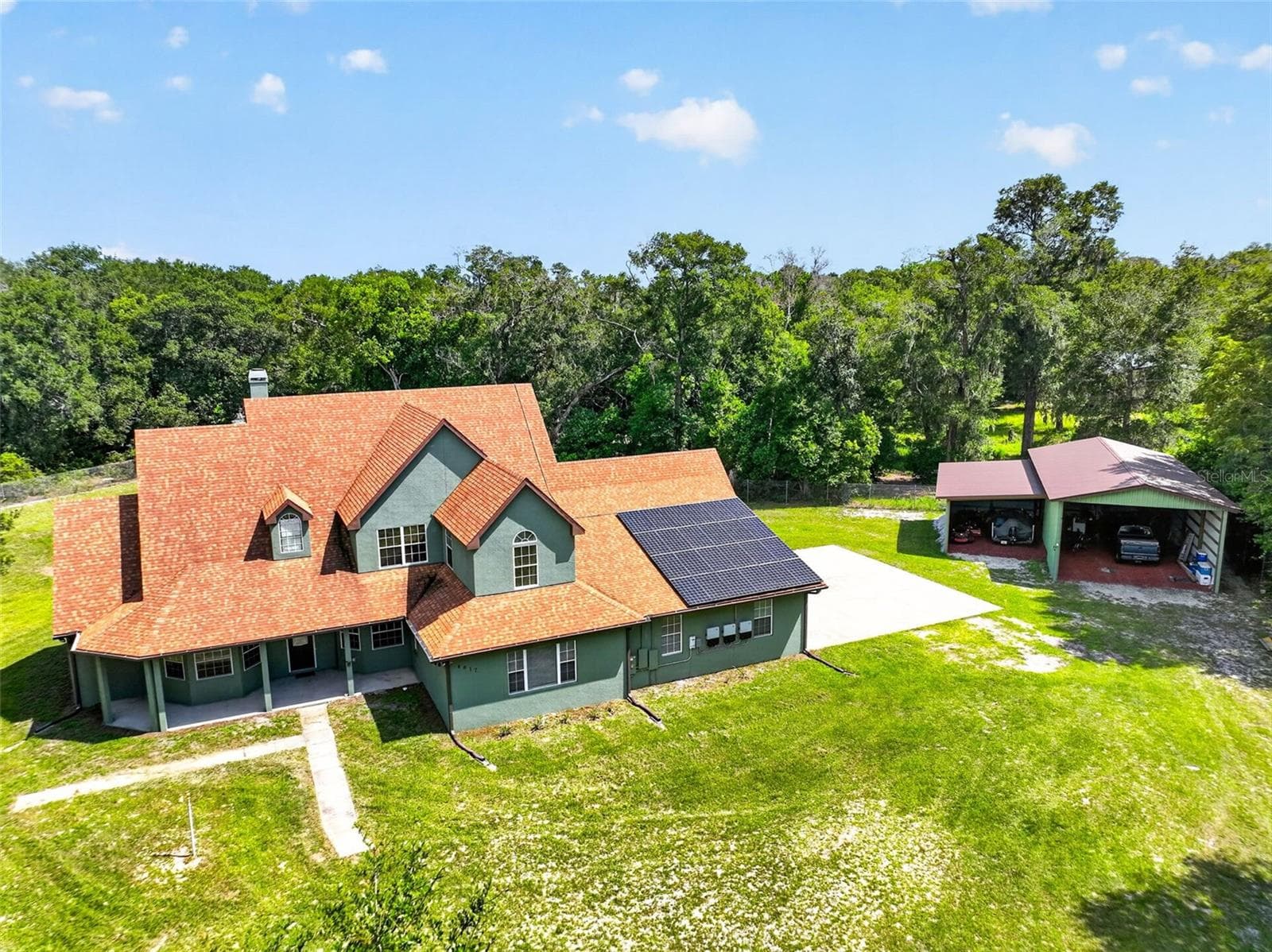 From above, the scope of this property comes to life: a detached outbuilding, lush grounds, and room to make it your own. - 4617 ROUND LAKE RD, APOPKA