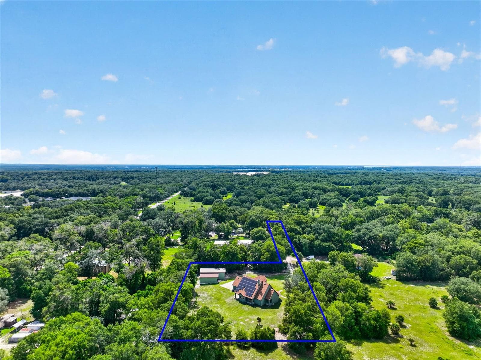 Nestled on a generous private lot surrounded by mature trees, this property offers seclusion rarely found this close to conveniences. - 4617 ROUND LAKE RD, APOPKA