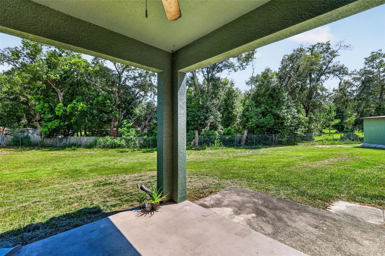 The backyard is a blank canvas: room for a pool, playground, garden beds, or simply letting the kids and pets run free. - 4617 ROUND LAKE RD, APOPKA