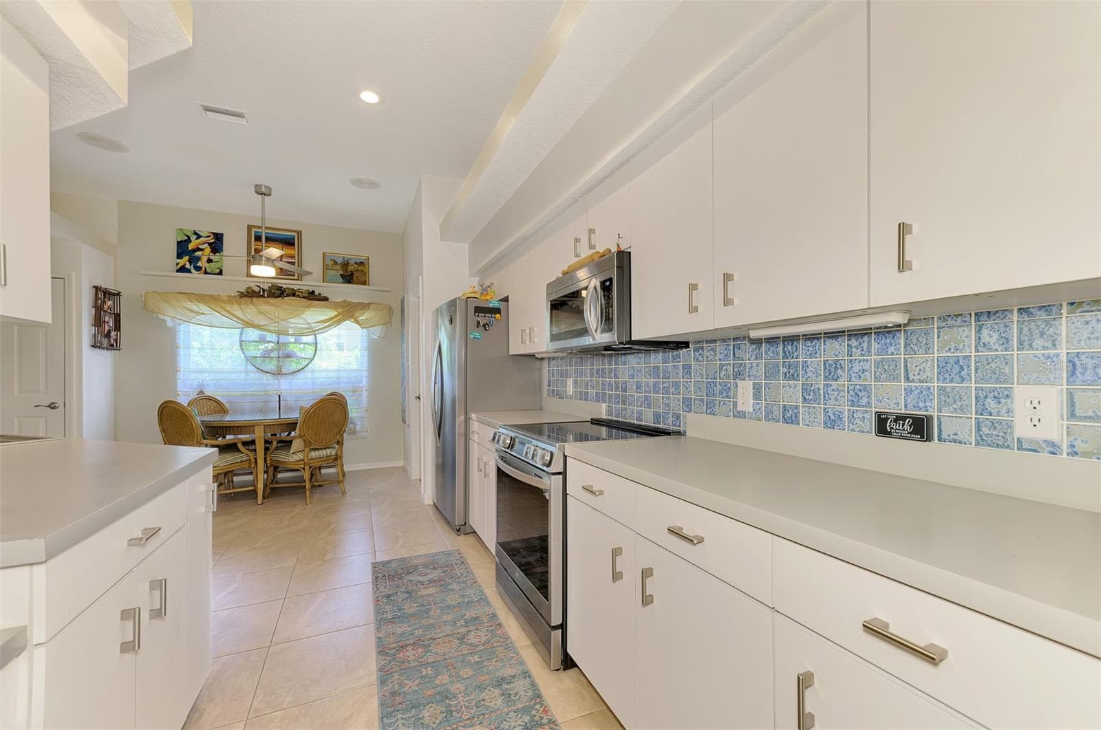 Kitchen with plenty of storage - 8252 PARKSIDE DR, ENGLEWOOD